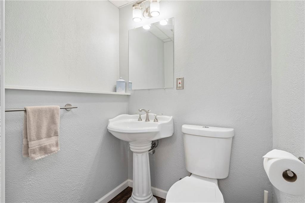 146 Pinehurst Drive Freedom, PA 15042 - Photo 23 of 30 a bathroom with a toilet sink and mirror