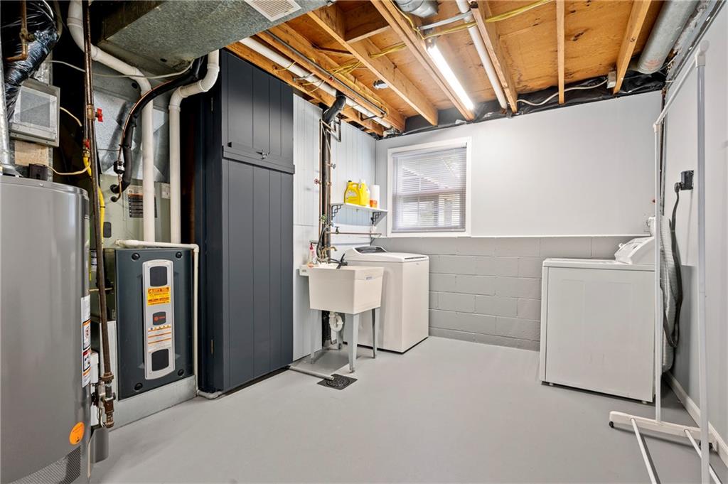 146 Pinehurst Drive Freedom, PA 15042 - Photo 24 of 30 a utility room with dryer and washer