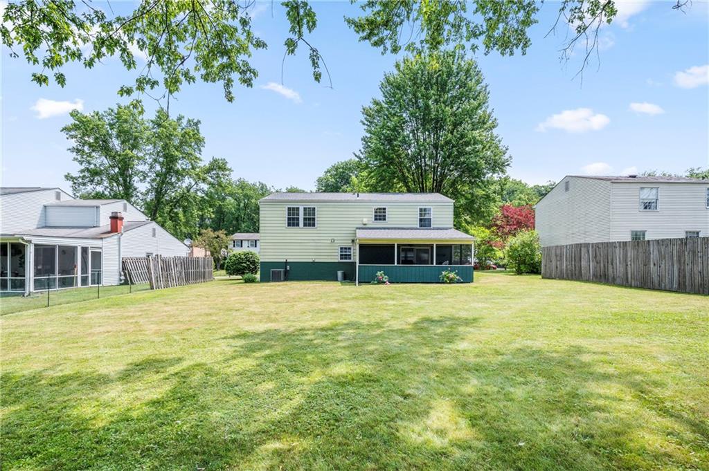 146 Pinehurst Drive Freedom, PA 15042 - Photo 29 of 30 a house with a yard and a large tree