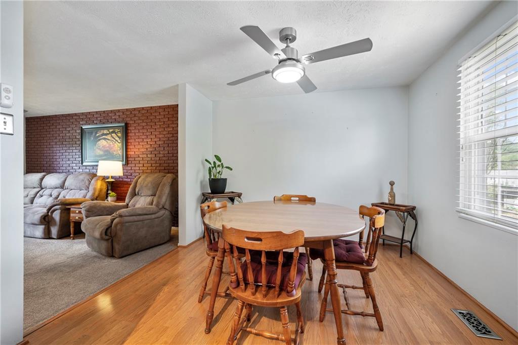 146 Pinehurst Drive Freedom, PA 15042 - Photo 8 of 30 a view of a dining room with furniture and wooden floor