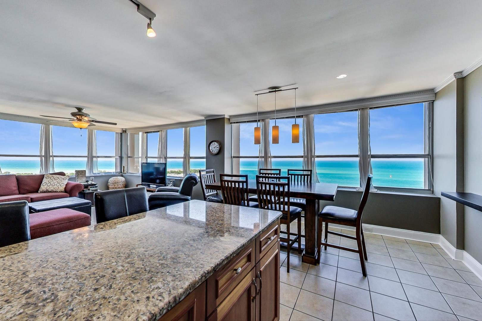 655 West Irving Park Road, Unit 3302 Chicago, IL 60613 - Photo 11 of 37 a view of a dining room with furniture window and outside view