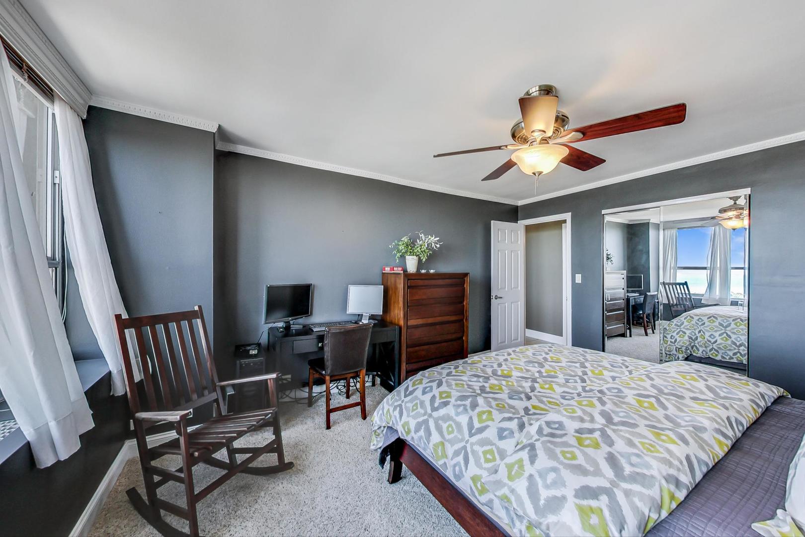 655 West Irving Park Road, Unit 3302 Chicago, IL 60613 - Photo 14 of 37 a bedroom with a bed a desk and chair