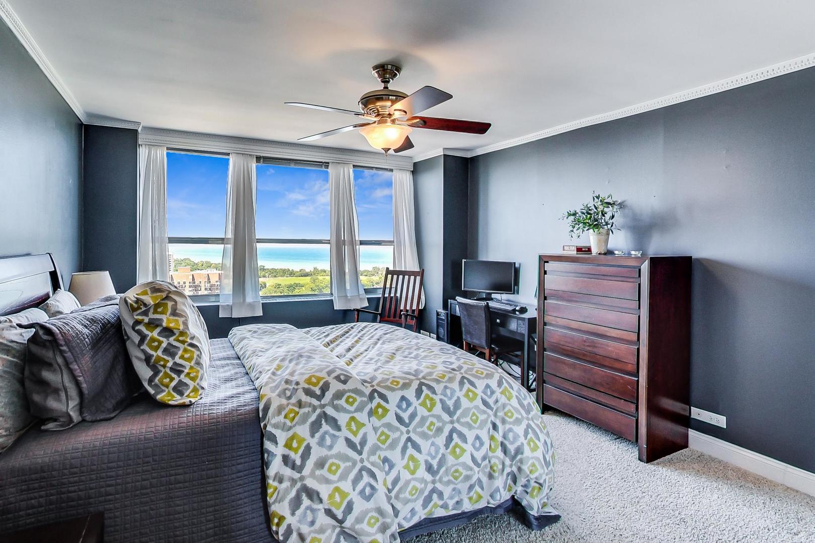655 West Irving Park Road, Unit 3302 Chicago, IL 60613 - Photo 15 of 37 a bedroom with a bed dresser and a window