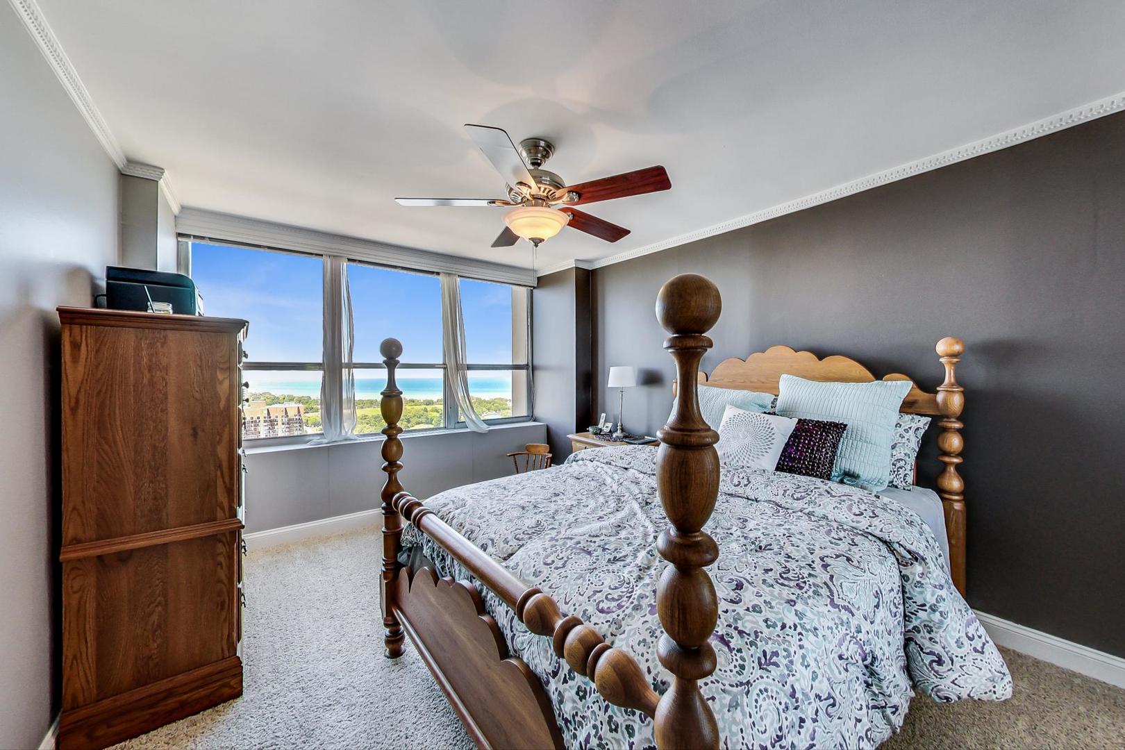 655 West Irving Park Road, Unit 3302 Chicago, IL 60613 - Photo 20 of 37 a bedroom with a bed and a refrigerator