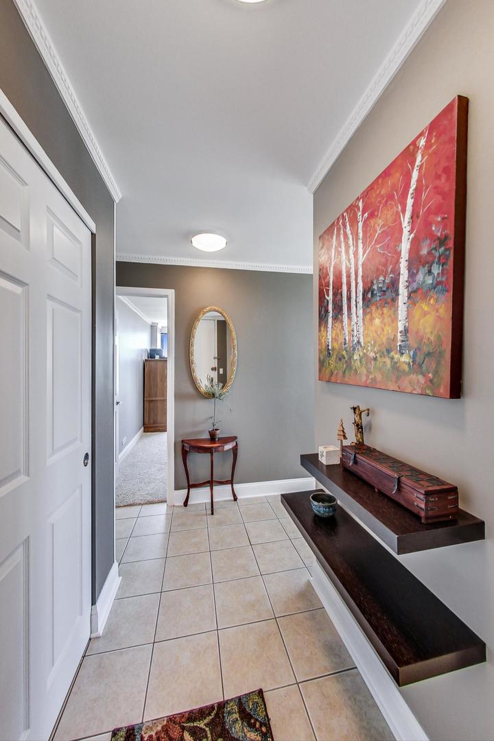 655 West Irving Park Road, Unit 3302 Chicago, IL 60613 - Photo 25 of 37 a living room with furniture and a table