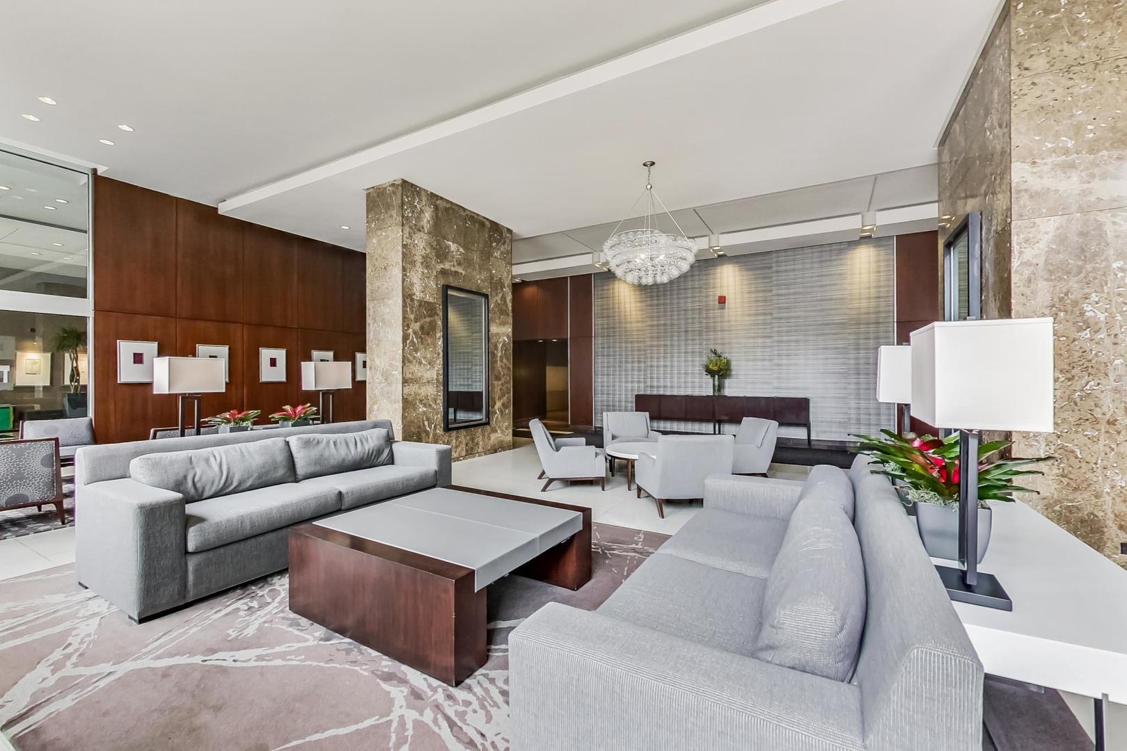 655 West Irving Park Road, Unit 3302 Chicago, IL 60613 - Photo 33 of 37 a living room with furniture and a large window