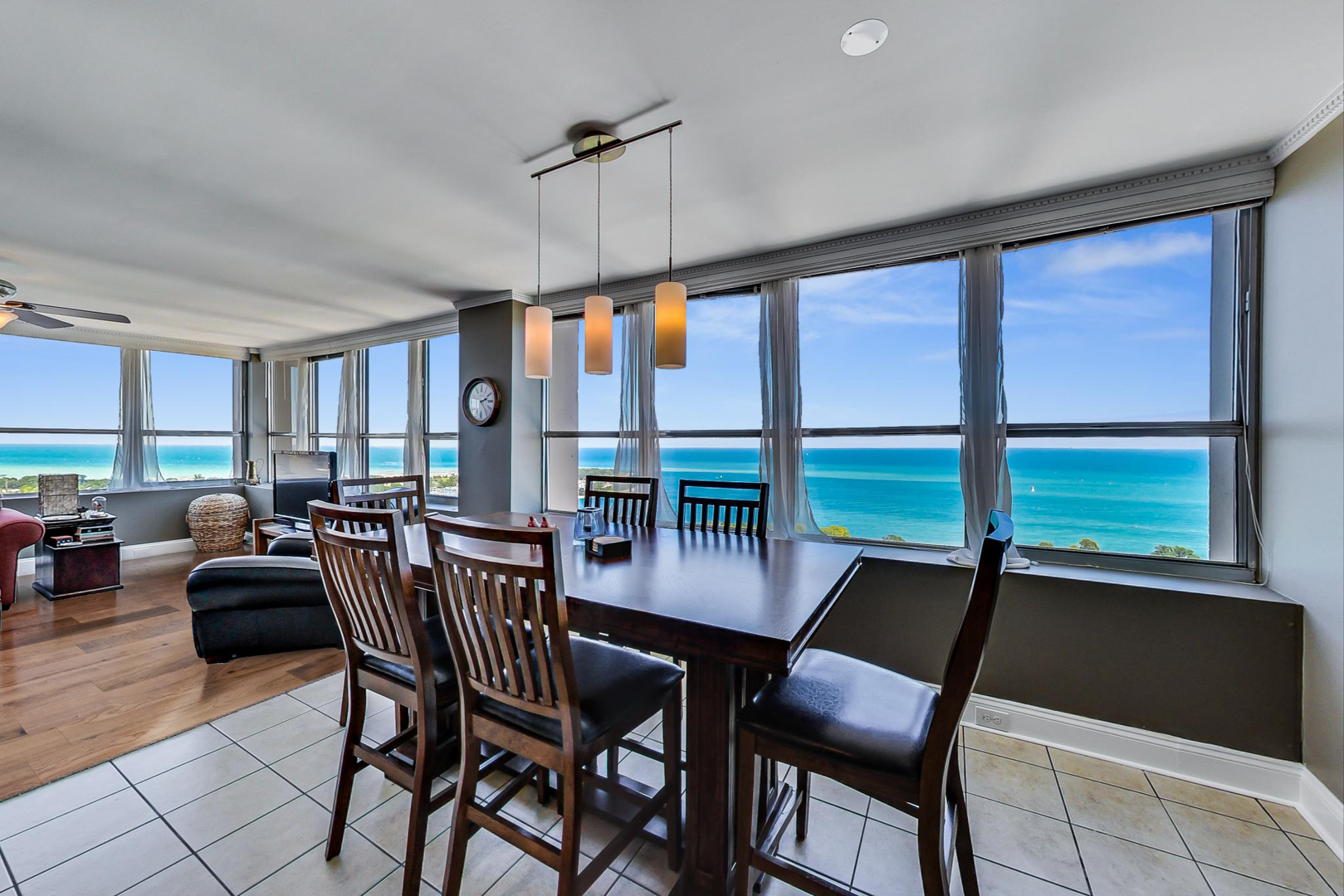 655 West Irving Park Road, Unit 3302 Chicago, IL 60613 - Photo 4 of 37 a view of a dining room with furniture window and outside view