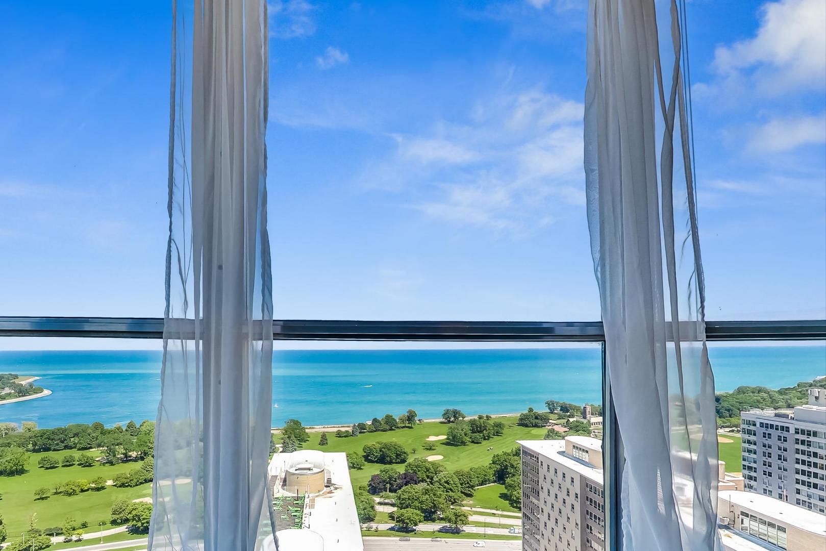 655 West Irving Park Road, Unit 3302 Chicago, IL 60613 - Photo 9 of 37 a view of a balcony next to a yard