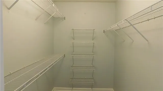 a bathroom with a double vanity sink a mirror and a bathtub