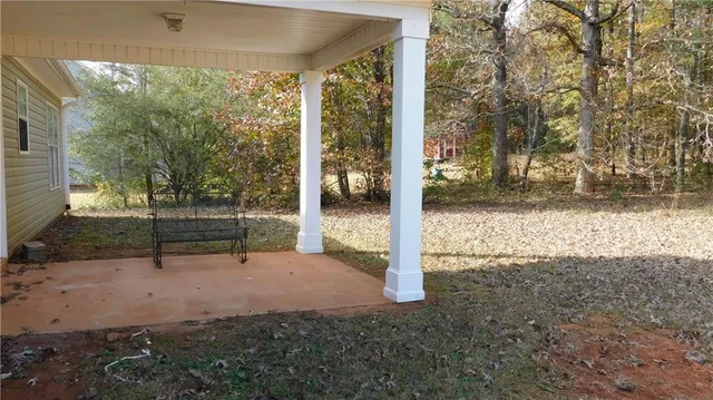 a view of a room with wooden floor and fence