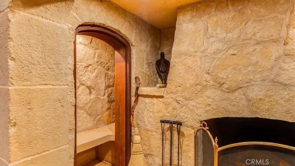 a utility room with a sink and wooden cabinets