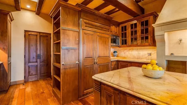 a view of a dining room with furniture wooden floor and chandelier