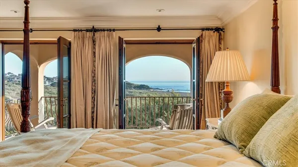 a spacious bedroom with a bed and a couch
