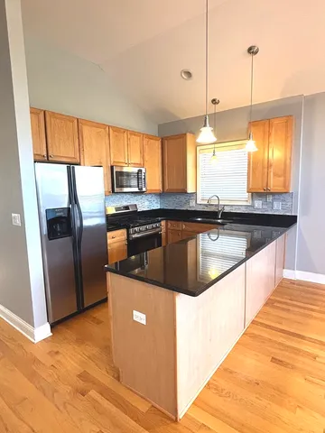 a bathroom with a sink a mirror and a shower