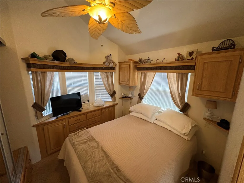 2358 Comanche Way Paso Robles, CA 93446 - Photo 13 of 30 a bedroom with a bed a flat tv screen and on a dresser