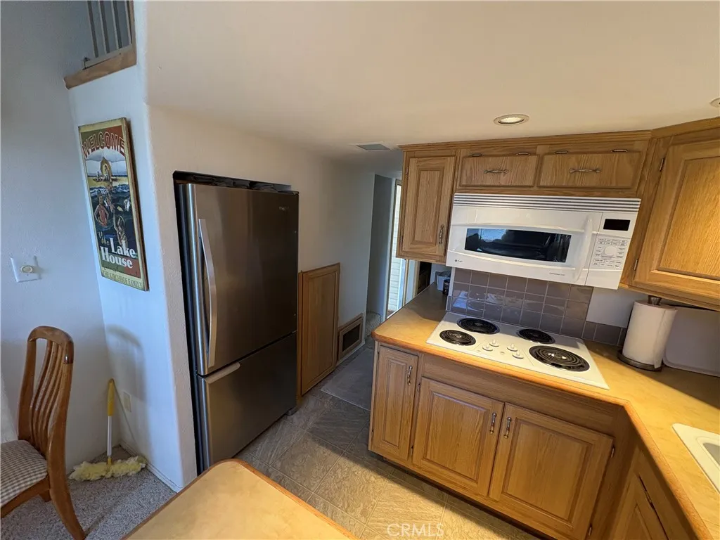 2358 Comanche Way Paso Robles, CA 93446 - Photo 15 of 30 a kitchen with stainless steel appliances granite countertop a refrigerator and a stove