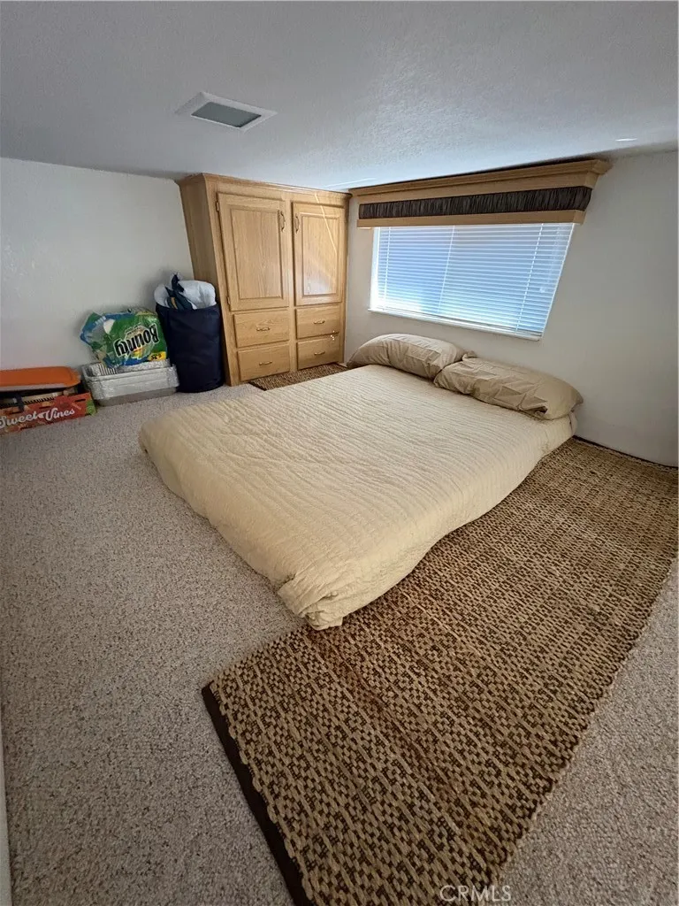2358 Comanche Way Paso Robles, CA 93446 - Photo 18 of 30 a bedroom with a bed and window