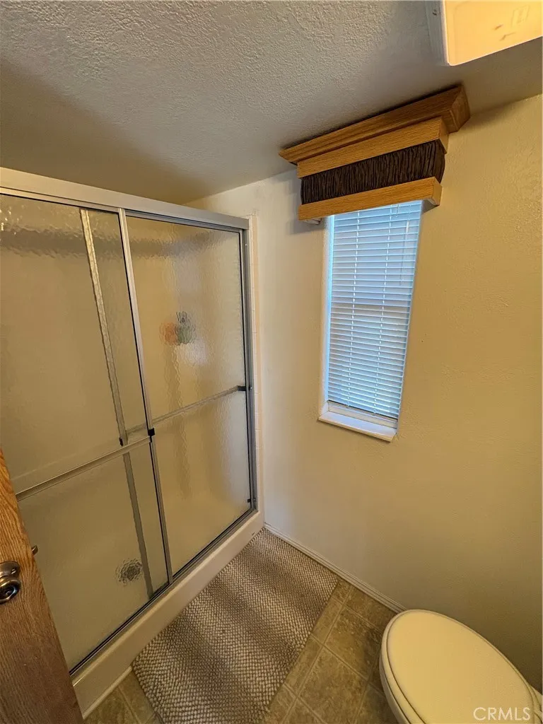 2358 Comanche Way Paso Robles, CA 93446 - Photo 23 of 30 a bathroom with a granite countertop sink and a mirror