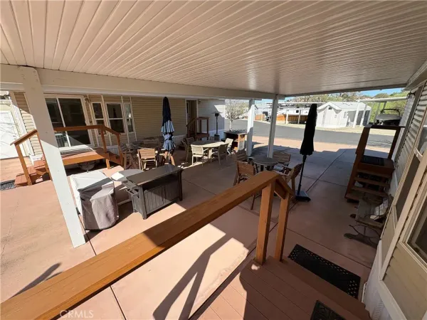 a view of a backyard with seating area