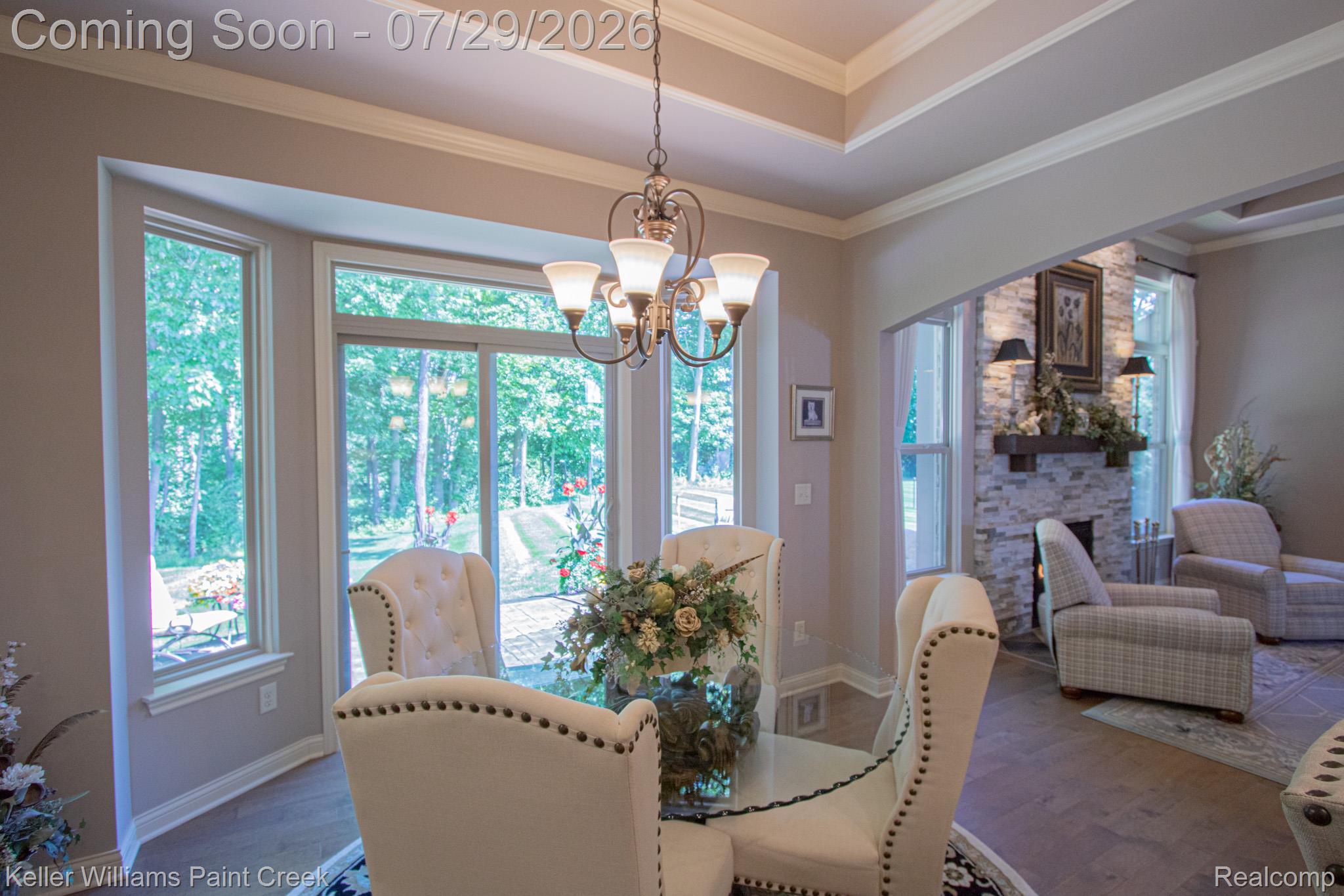49118 Ridgeview Drive Macomb, MI 48044 - Photo 10 of 57 Dining area with extensive bay windows, tray ceiling, and a chandelier