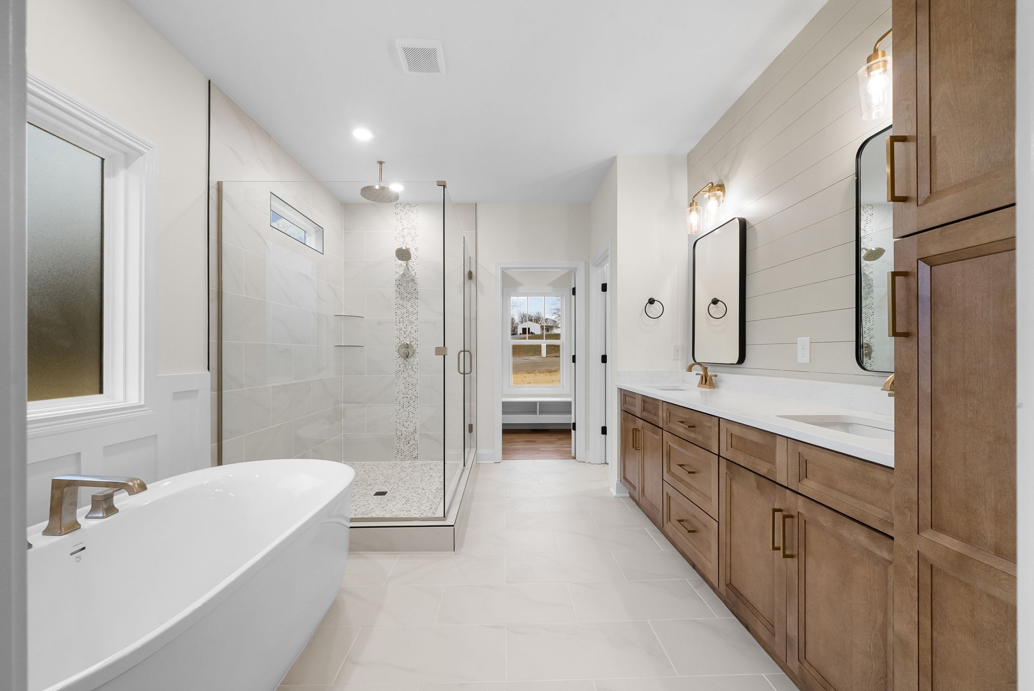 1800 Gholson Road Clarksville, TN 37043 - Photo 20 of 33 a bathroom with a double vanity sink a large mirror a shower and bathtub