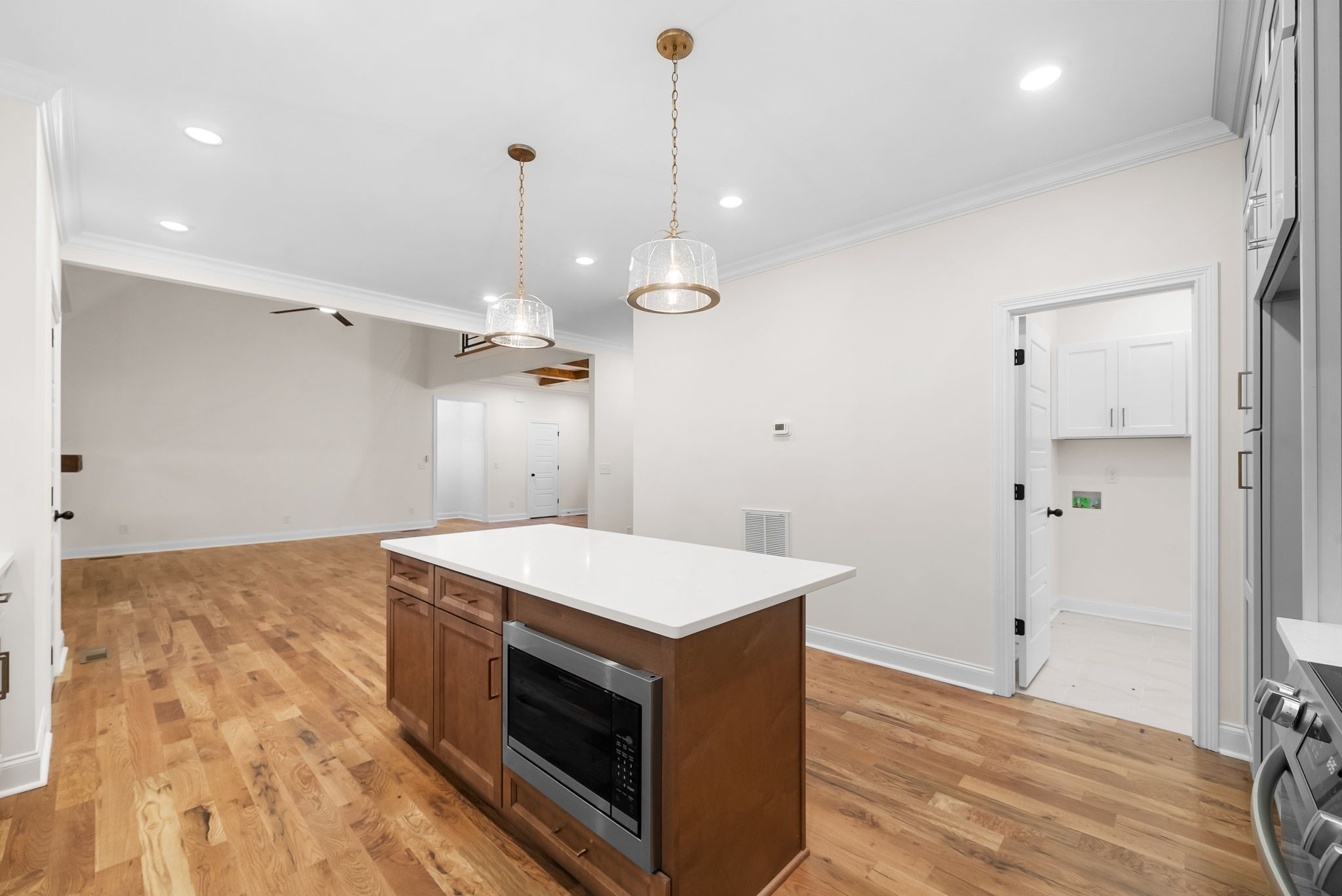 1800 Gholson Road Clarksville, TN 37043 - Photo 27 of 33 a kitchen that has a sink a stove and a wooden floor