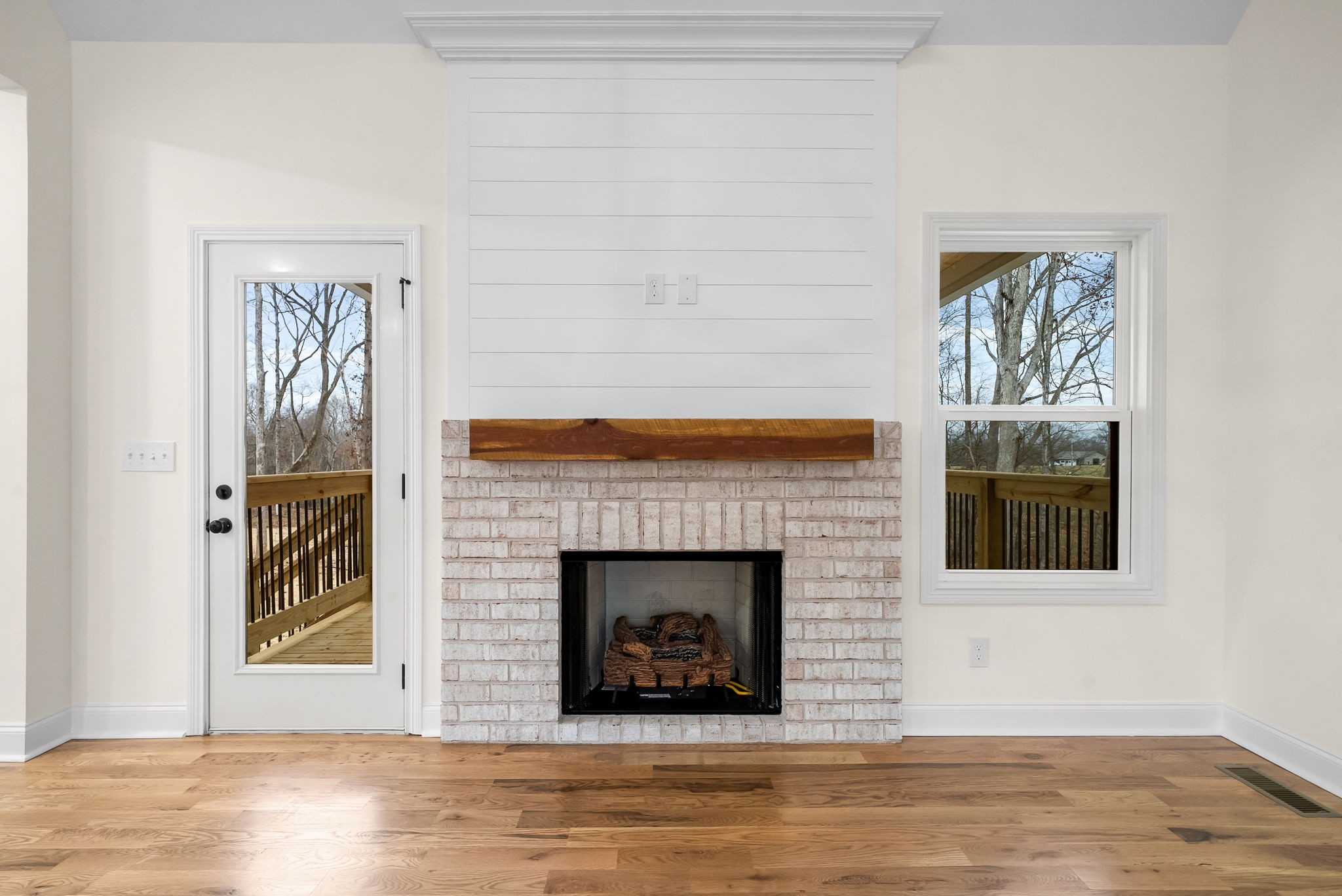 1800 Gholson Road Clarksville, TN 37043 - Photo 28 of 33 a living room with a fireplace and a wooden floor
