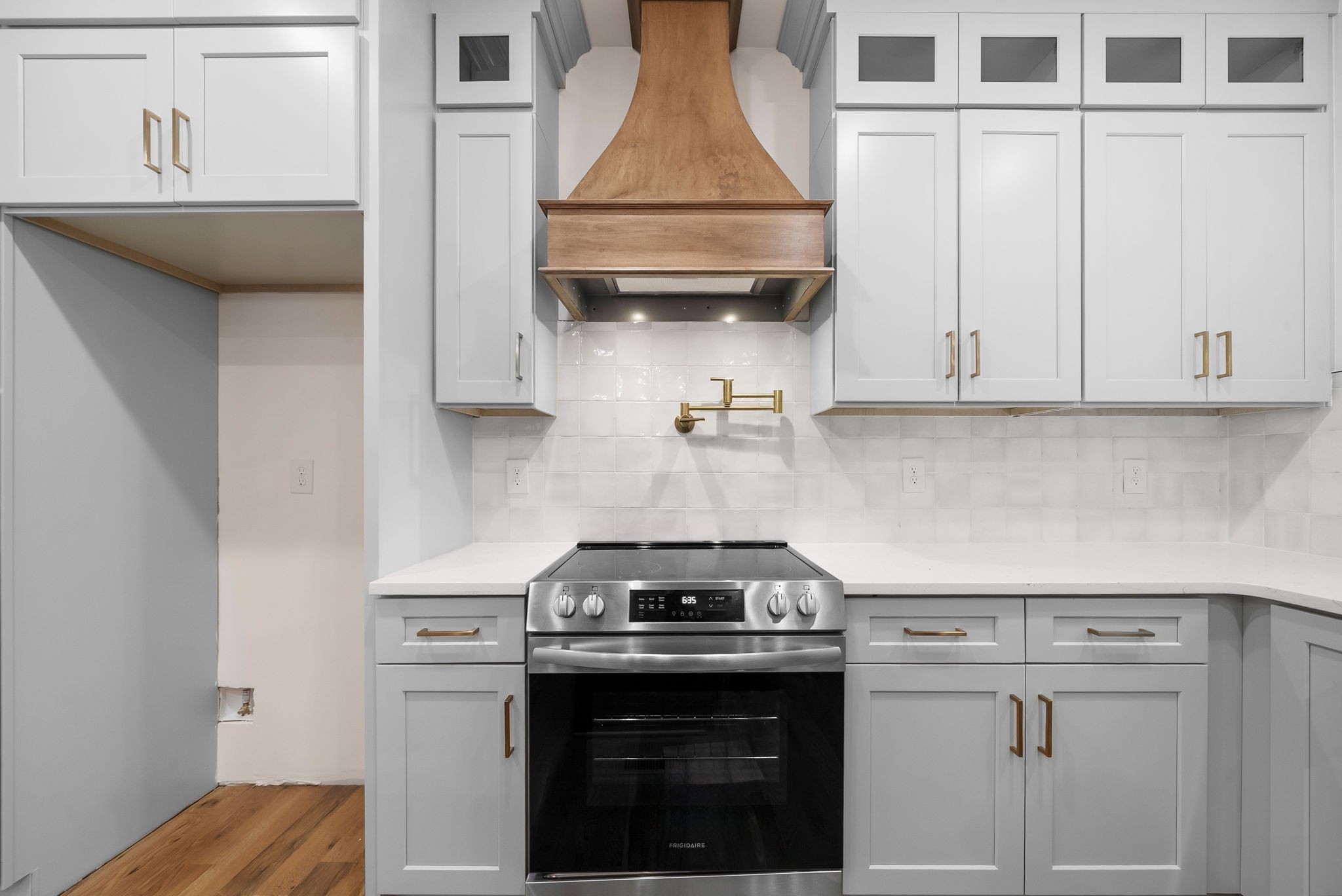1800 Gholson Road Clarksville, TN 37043 - Photo 8 of 33 a kitchen with granite countertop white cabinets and black appliances