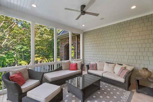 a bedroom with a large bed and a fireplace