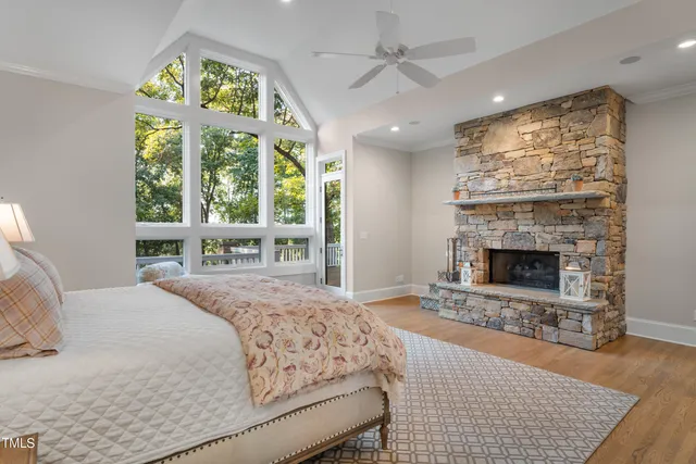 a spacious bedroom with a large bed and a window