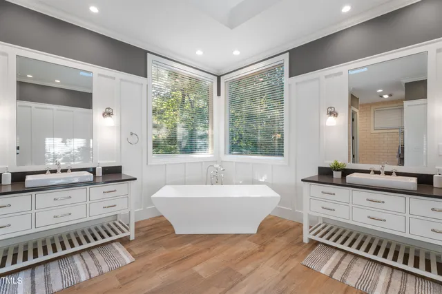 a en suite bathroom with a sink and a mirror