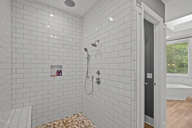 a bathroom with a bathtub and toilet