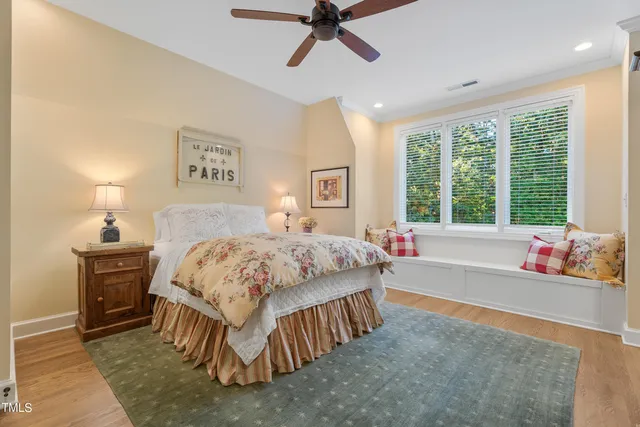 a kitchen with a sink and wooden floor