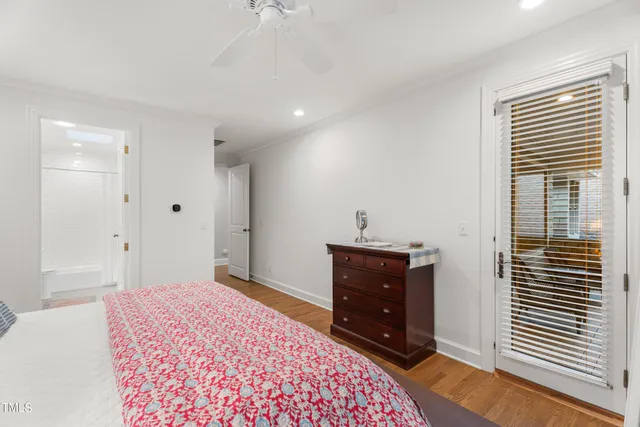 a view of a house with a tree and a yard