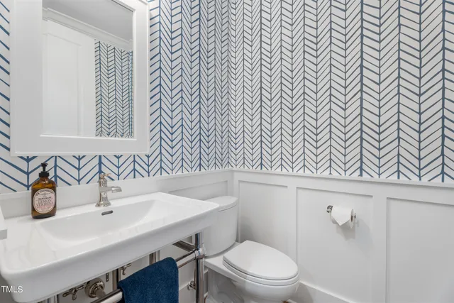 an aerial view of a house with garden space and street view