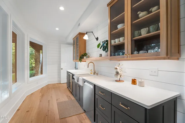 an aerial view of a houses with a yard