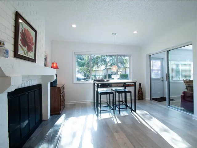 a view of a livingroom with furniture and a fireplace