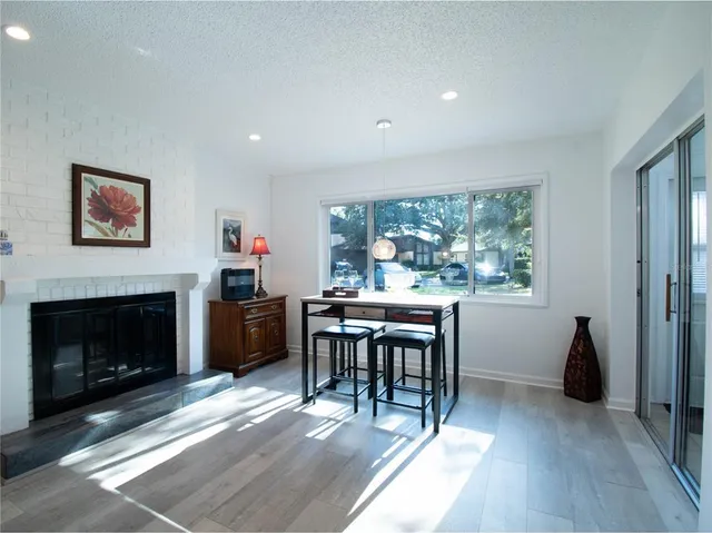 a view of a livingroom with furniture and a fireplace