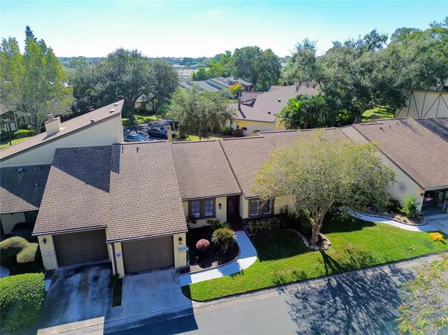 a aerial view of a house with table and chairs