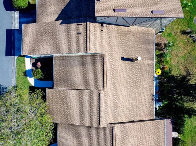 a view of a chairs and table in the patio