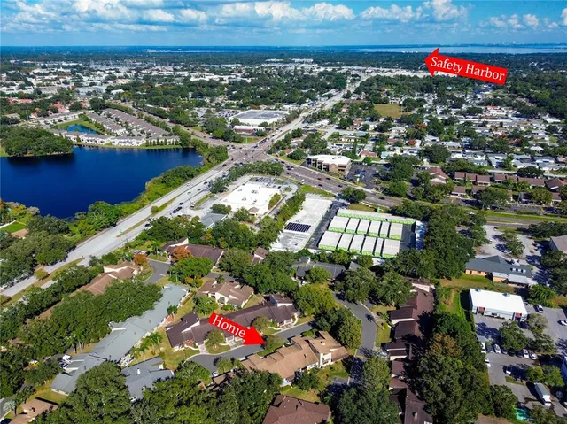 an aerial view of a houses with a yard