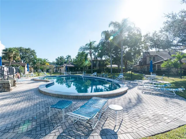 a kitchen with granite countertop a sink and cabinets