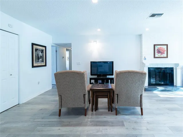 a view of a livingroom with furniture and a flat screen tv