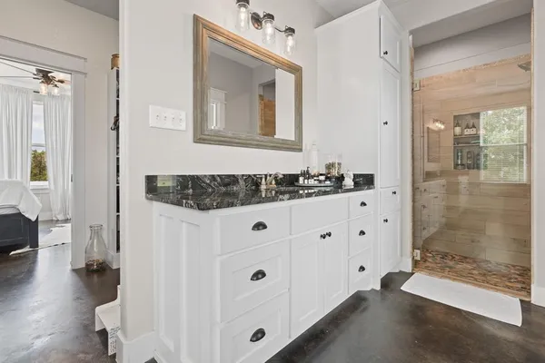 a bathroom with a double vanity sink and mirror
