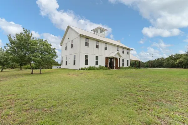 a view of a house with a big yard