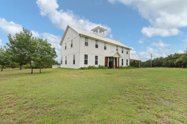 a view of a house with a big yard