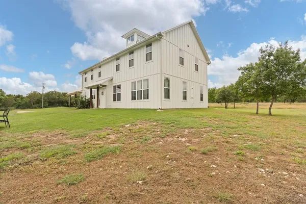 a view of a building with a yard