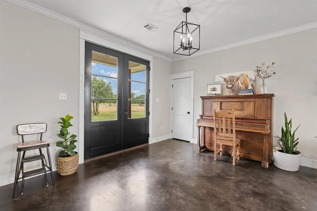 a view of livingroom with furniture window and front door