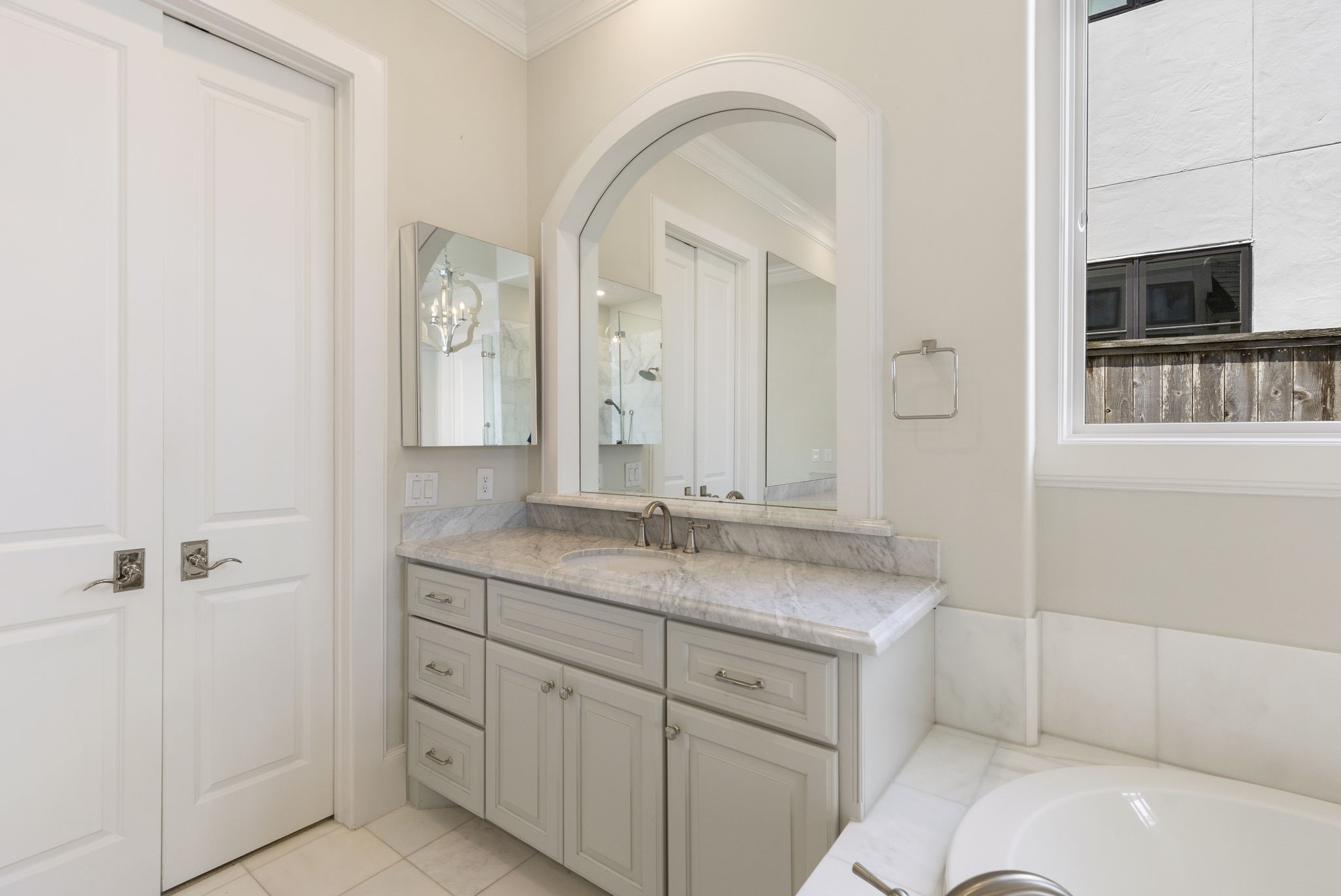 6806 West Warwick Lake Lane Spring, TX 77389 - Photo 21 of 50 a bathroom with a granite countertop sink a mirror and shower