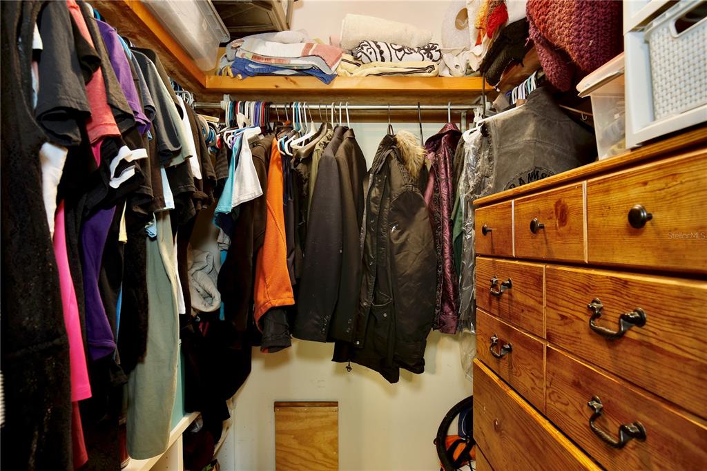 425 Mercers Fernery Road DeLand, FL 32720 - Photo 19 of 54 a view of walk in closet with clothes and shoes